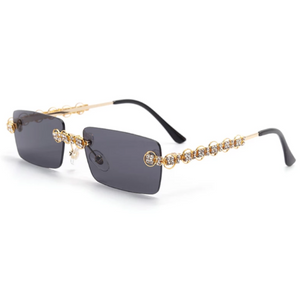 gold jeweled sunglasses with black lenses