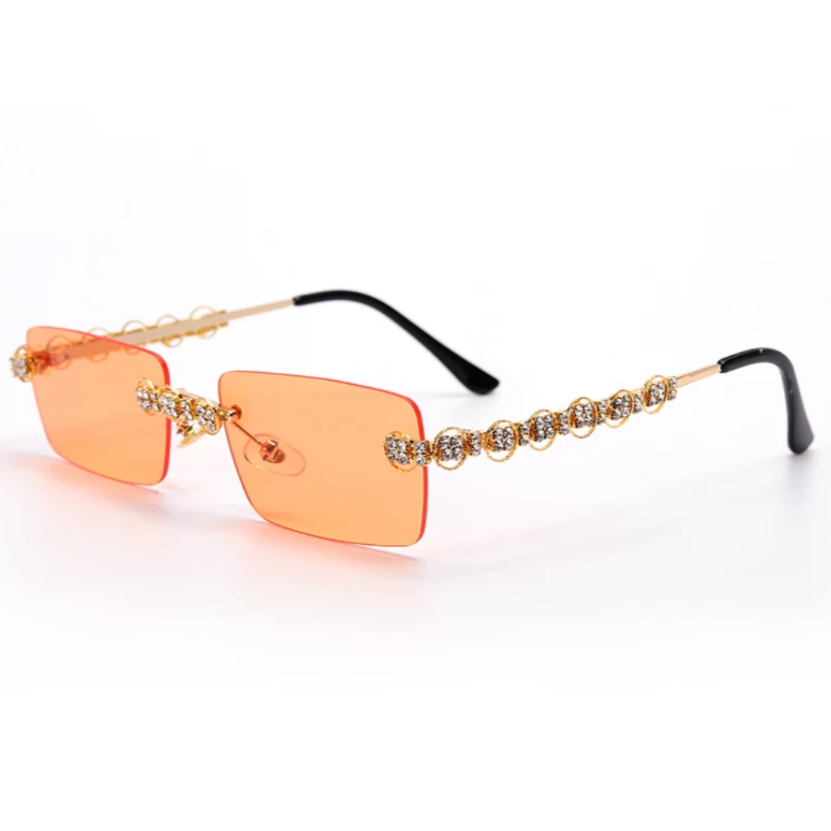 gold jeweled sunglasses with orange lens