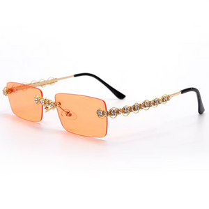 gold jeweled sunglasses with orange lens